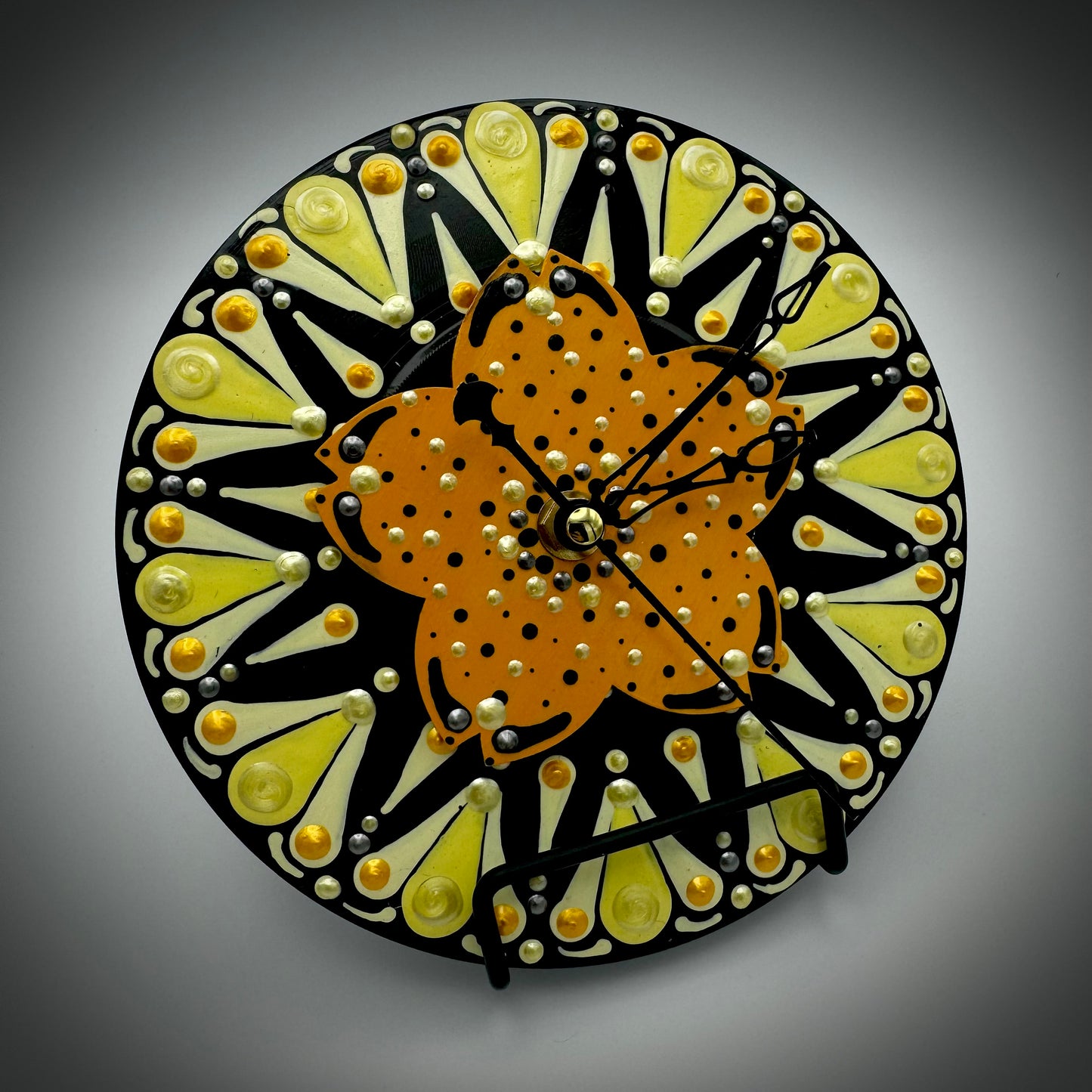 Art Clock on 45 Vinyl Record, Orange and Yellow Star Burst with Flower Wood Inlay