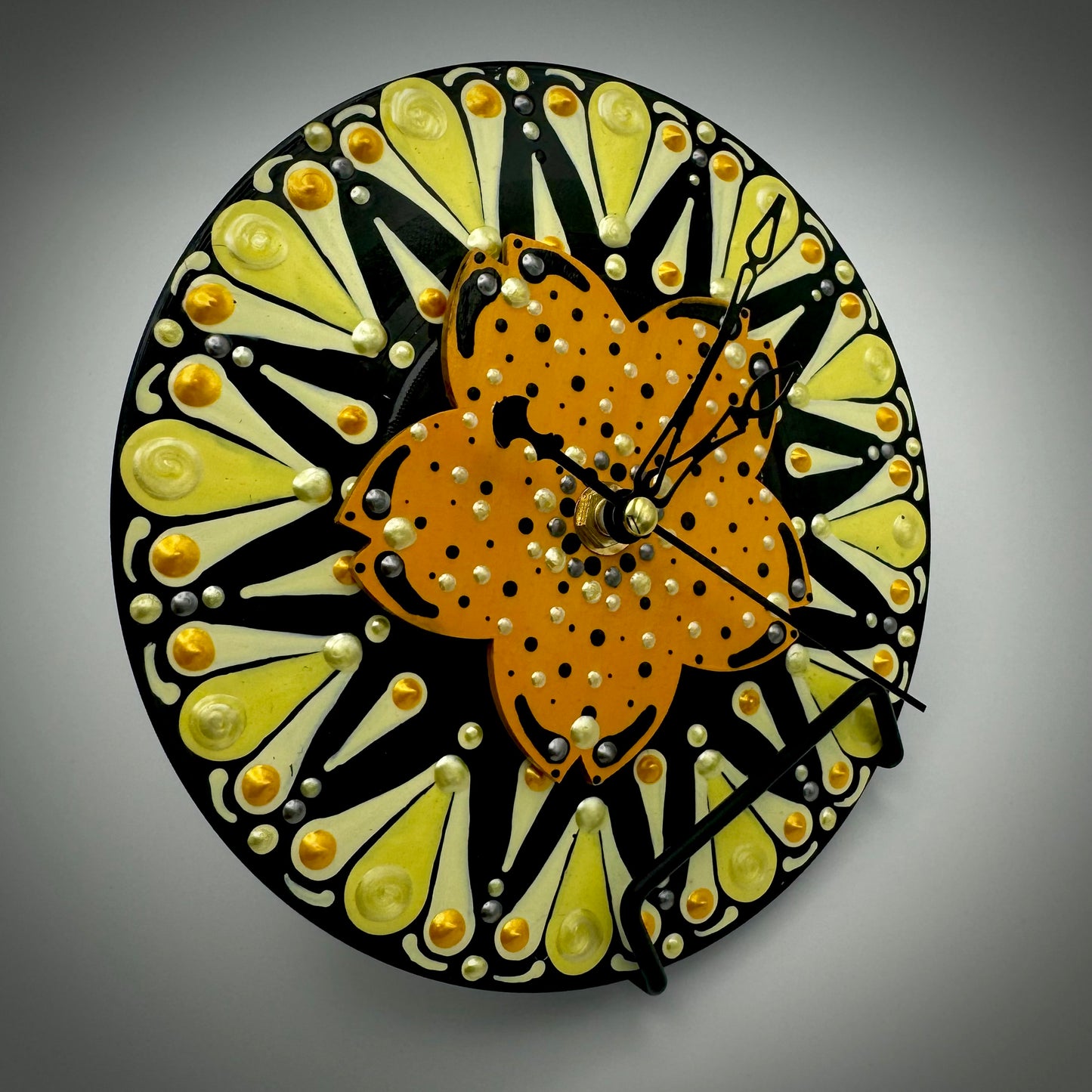 Art Clock on 45 Vinyl Record, Orange and Yellow Star Burst with Flower Wood Inlay